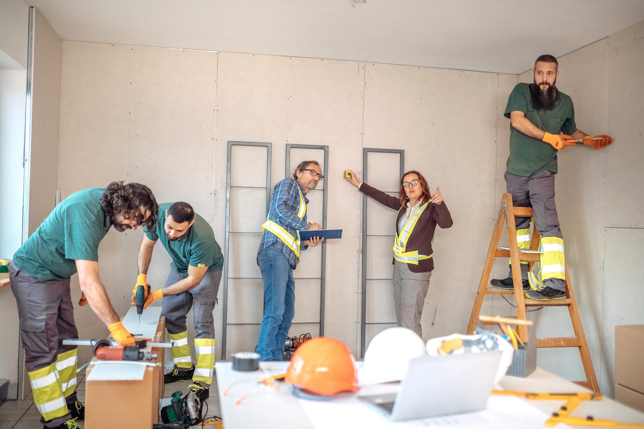 Construction team working in a room.
