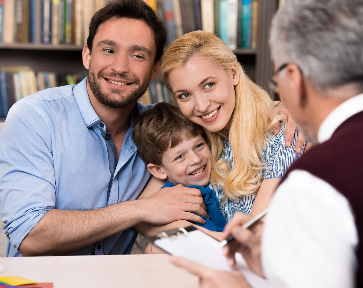 Family consulting with a professional in office.